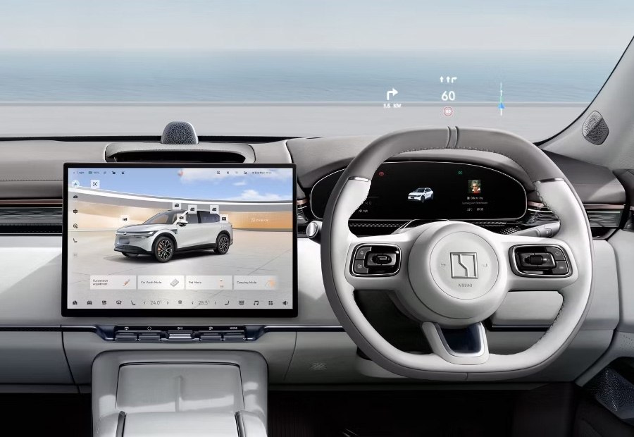 Right hand drive interior of a Zeekr showing the steering wheel and centre screen