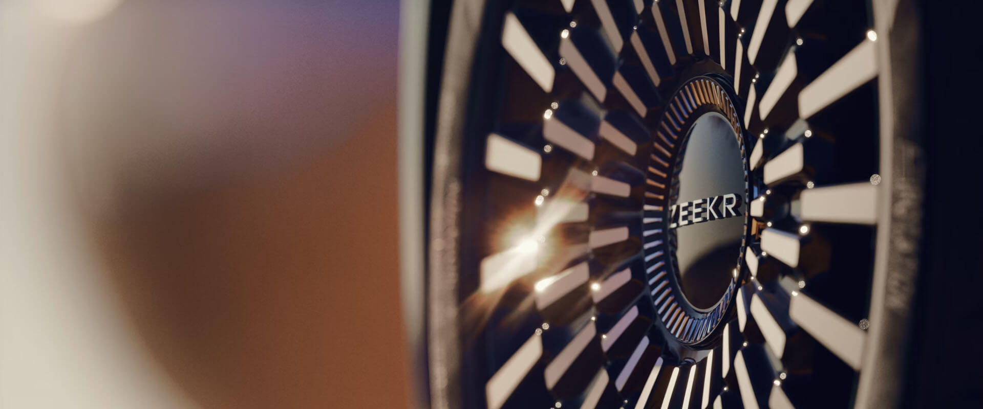 Close up photo of a Zeekr logo in the middle of an alloy wheel
